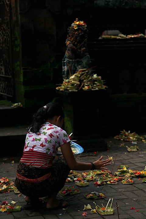Woman Setting Offerings at Ubud Market