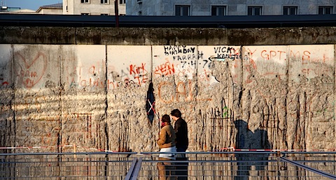 Couple walking by Wall