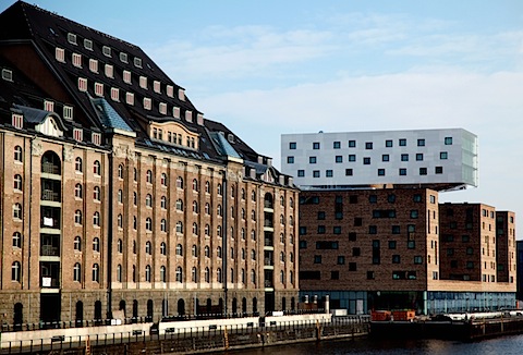 Modern building and old building on Spree