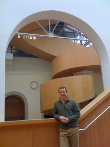 Andrew in front of Staircase