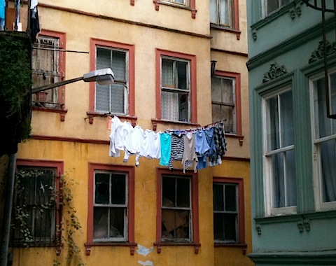 Laundry Hanging Over Street