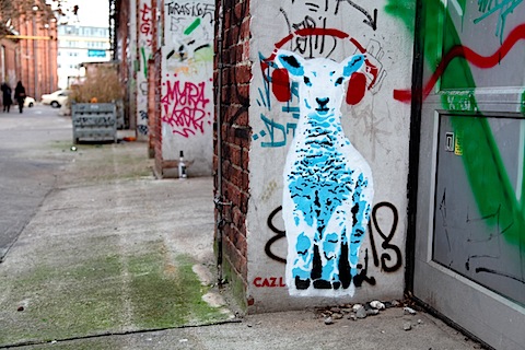 Street art sheep with headphones