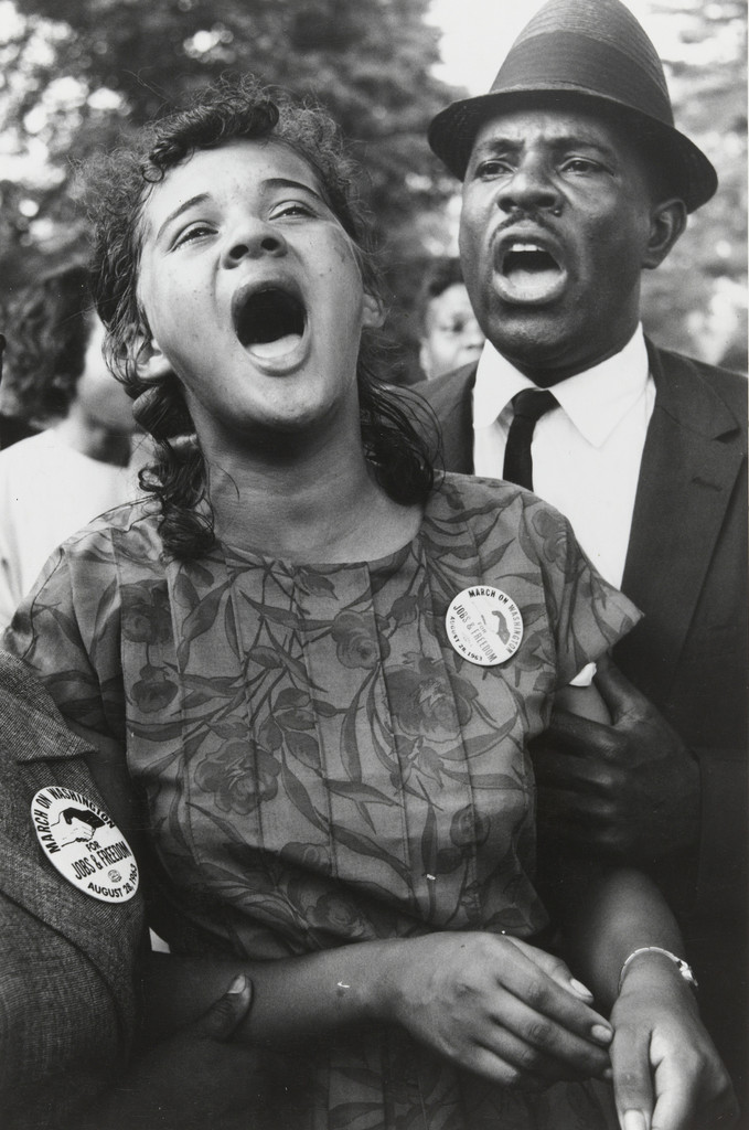 Washington, D.C.: Demonstrators sing "We Shall Overcome" after Dr. Martin Luther King, Jr.'s "I Have a Dream" speech