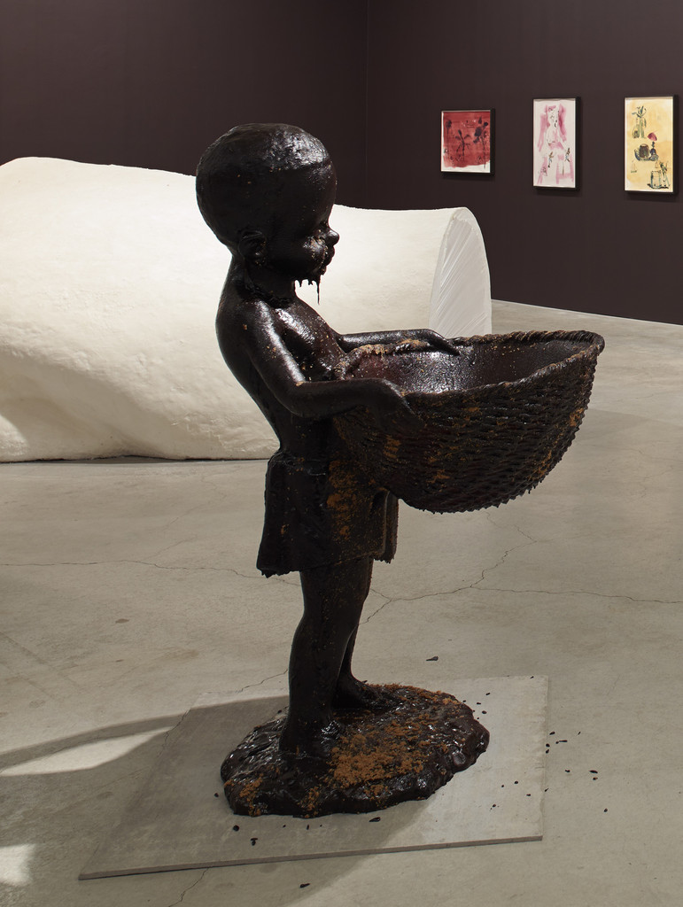 African Boy Attendant Curio with Molasses and Brown Sugar, from "The Marvelous Sugar Baby" Installation at the old Domino Sugar Factory Warehouse (Front Basket)