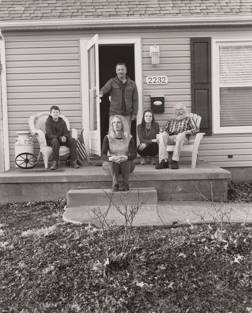 Trisha Brown, UAW Local 1714, Women’s Committee, sitting on her front door step at home with her father Bob, her two children Mackenzie and Connor Acierno, and her boyfriend Dave Lopez, (8 years in at GM Lordstown Complex, laser braze decklid area team 23), Youngstown OH.