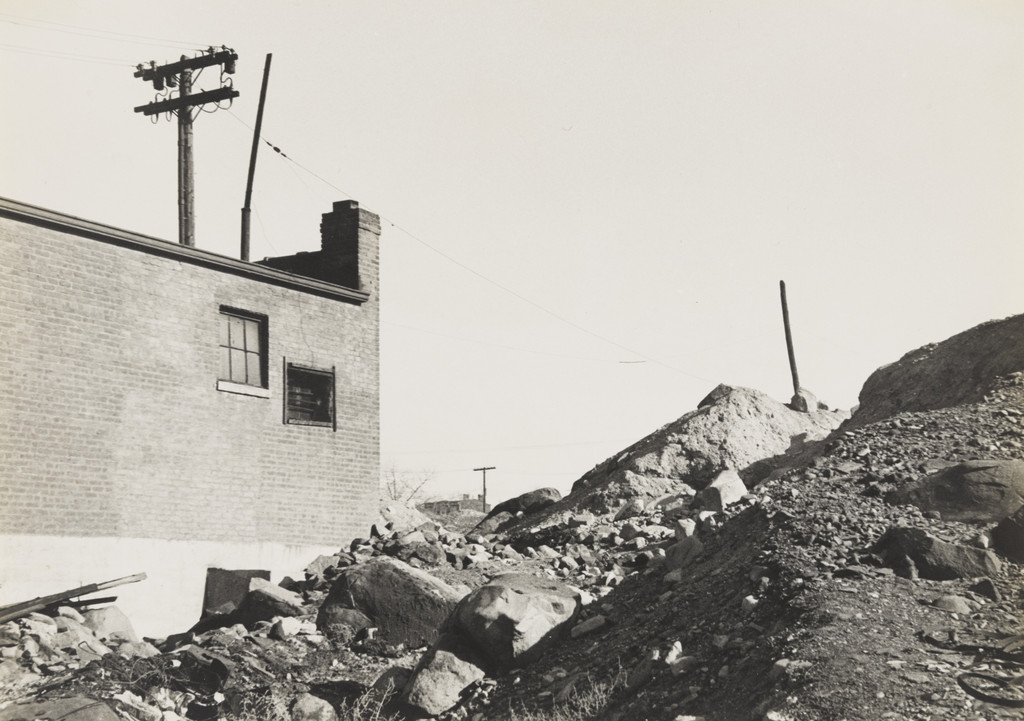 Laurel Hill, Queens. (building and mounds of dirt)