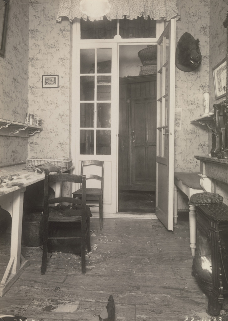Untitled (crime scene: woman dead on kitchen floor)