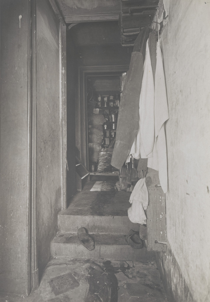 Untitled (crime scene: view down hall with shoes on steps)