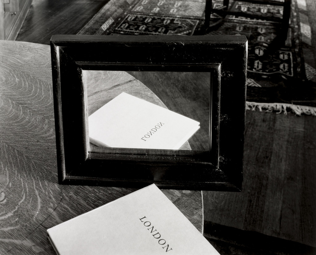 Book and Mirror on Round Table