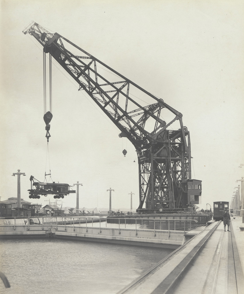 Floating crane "Hercules" transferring equipment across Gatun Locks from the east side. Steam shovel suspended in air