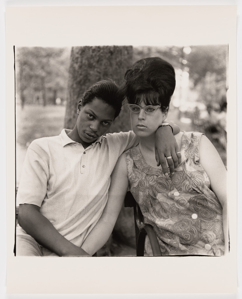 A young man and his pregnant wife in Washington Square Park, N.Y.C., 1965